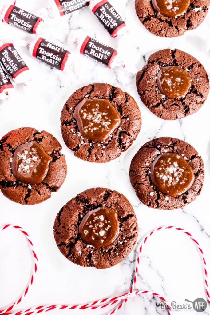 Tootsie Roll Cookies - These chocolate Tootsie Roll® cookies take the forgotten and sometimes disregarded Tootsie Roll® to a whole new level.  Take the humble Tootsie Roll from zero to hero with these homemade chocolate thumbprint cookies filled with an easy to make Tootsie Roll® ganache and sprinkled with sea salt.