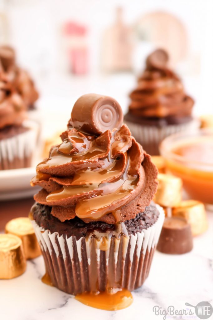 Chocolate Caramel Rolo Cupcakes - The perfect combination of chocolate and caramel come together with these homemade Chocolate Caramel Rolo Cupcakes! Homemade chocolate cupcakes are stuffed with a Rolo® chocolate and topped with fudgy chocolate frosting, drizzled caramel sauce and finished off with another Rolo® candy for the ultimate indulgent treat.
