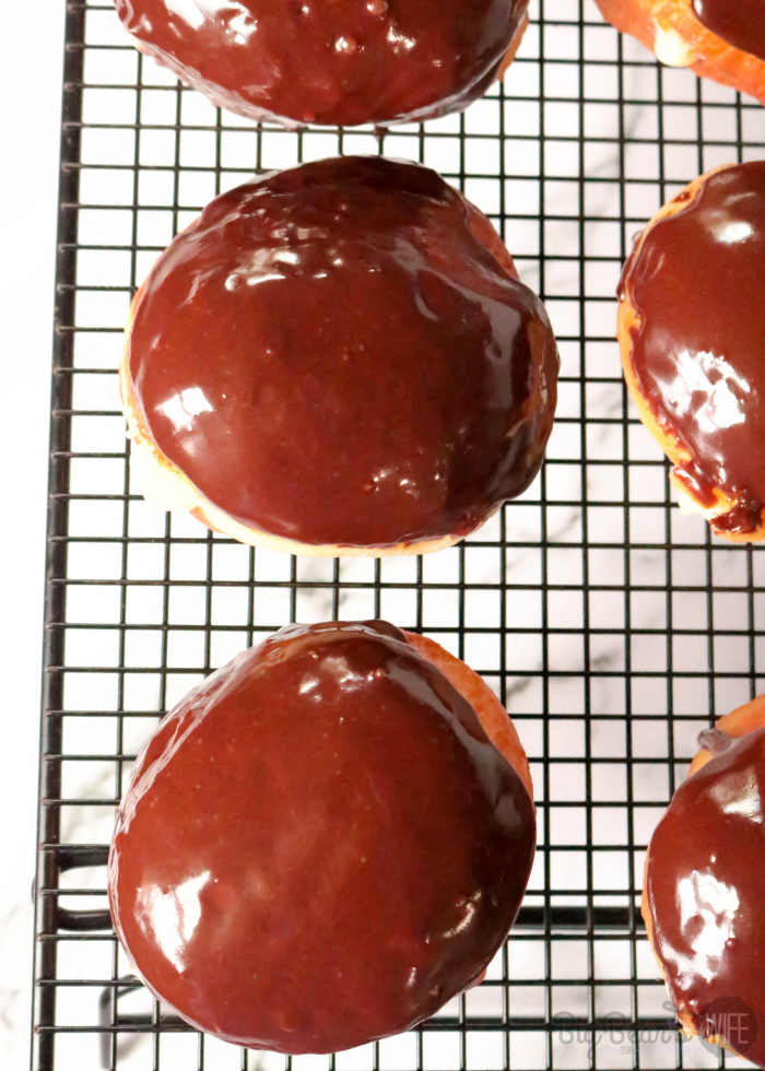 These Homemade Boston Cream Doughnuts are a take on on the popular Boston Cream Pie dessert! Don't be afraid of making homemade doughnuts! It's easier to make doughnuts at home, than you think !