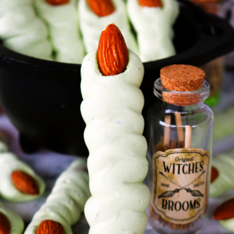 These easy Meringue Witch Finger Cookies are crispy, creepy and perfect for Halloween. These witch finger cookies are made with a meringue cookie recipe, colored green for of a bit of a classic witch look and decorated with an almond as the creepy witch nail!