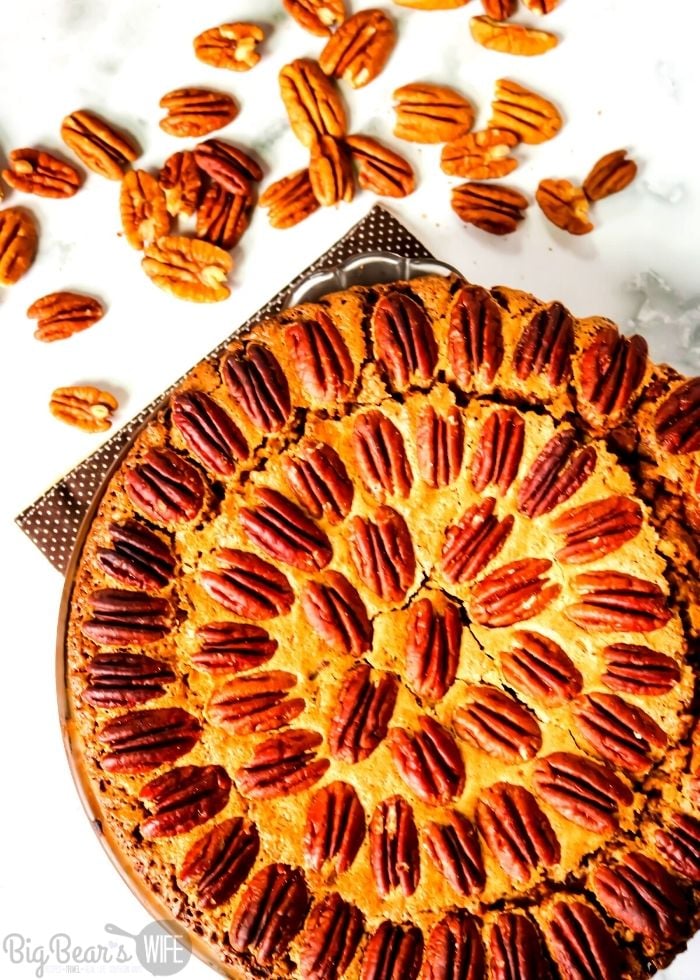 This Cinnamon Bun Pecan Pie has a cinnamon bun pie crust and an amazing and easy homemade pecan pie filling! Drizzle it with cream cheese frosting and you've got the perfect marriage of cinnamon buns and pecan pie!
