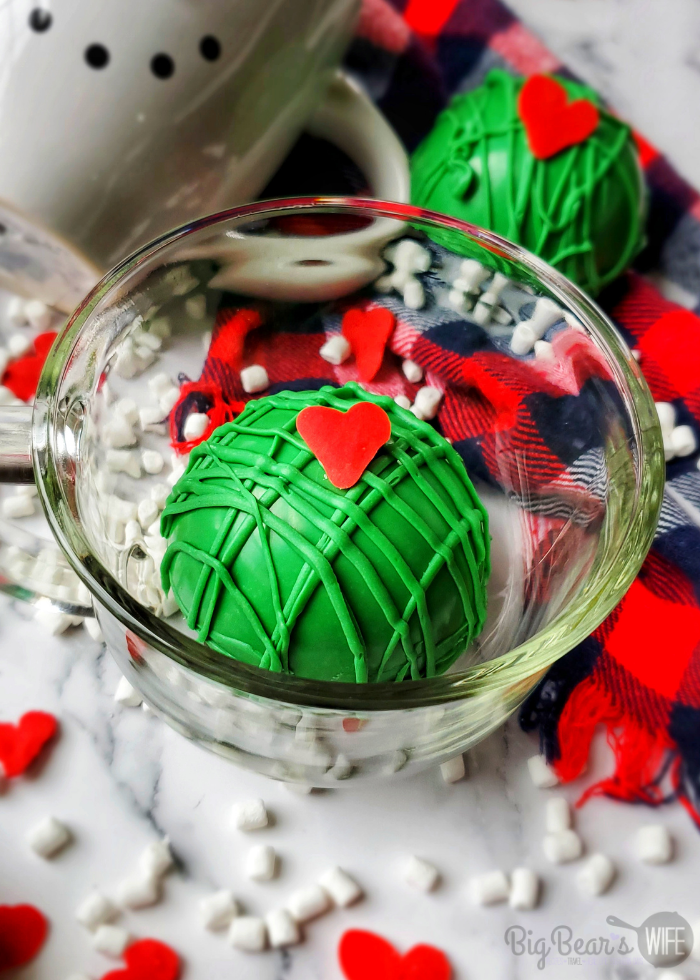 Our favorite Christmas hot coco bombs are getting a Grinchy Whoville makeover with these fun Christmas Grinch Hot Chocolate Bombs!!