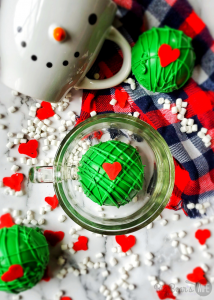 Our favorite Christmas hot coco bombs are getting a Grinchy Whoville makeover with these fun Christmas Grinch Hot Chocolate Bombs!!