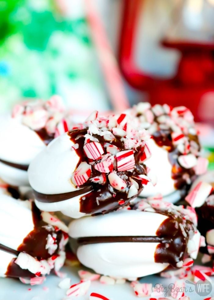 Meringue cookies dipped in chocolate with crushed candy canes
