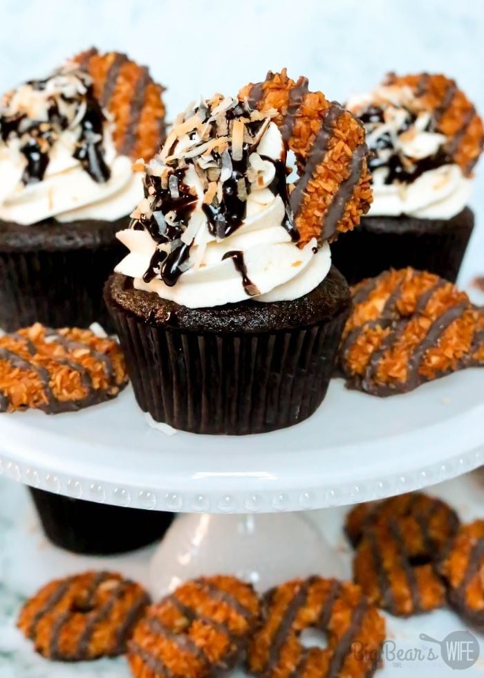 Turn your favorite Samoa cookie Girl Scout cookies into a homemade treat with these Samoa Cupcakes! These chocolate cupcakes have a caramel frosting and are topped with chocolate, toasted coconut and Samoa Cookies!