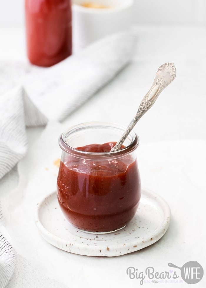 Homemade Brown Sugar BBQ Sauce in small glass jar with white background