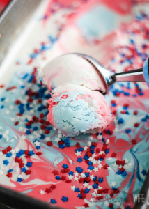 Scooping Red White and Blue Tie Dye Ice Cream in a loaf pan with sprinkles