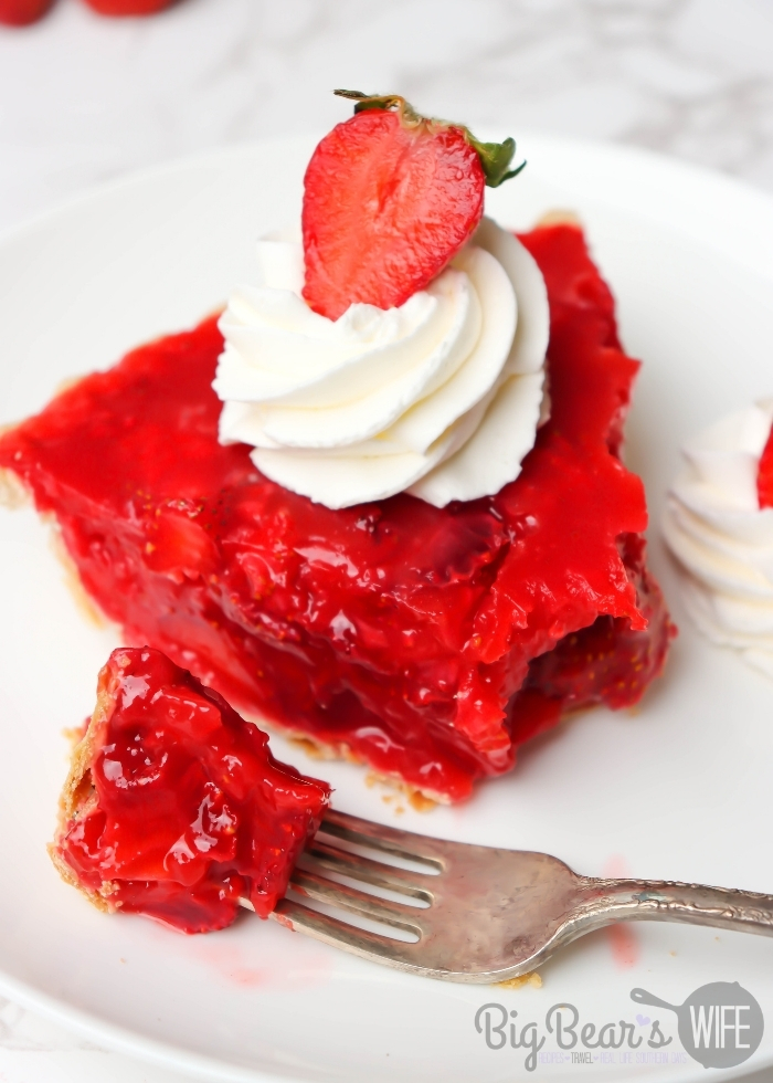 Slice of VINTAGE JELLO STRAWBERRY PIE on a white plate missing a bite of pie