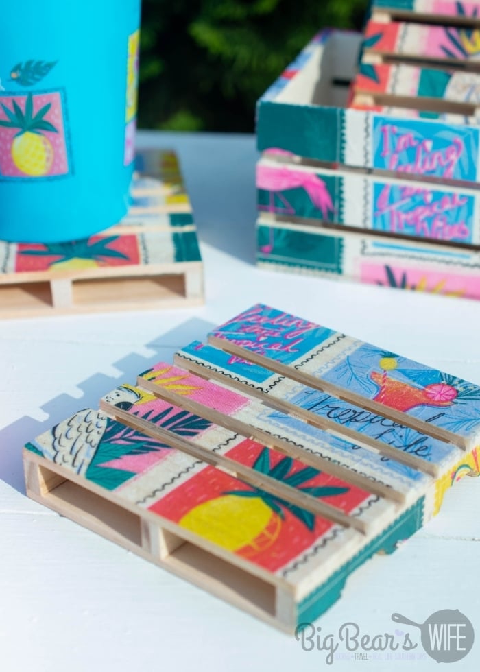 These adorable DIY Mini Pallet Coasters are perfect for summer and super cute for the patio or beside the pool! They're made using napkins, mod podge and mini wooden pallets from Dollar Tree! This step by step photo tutorial will show you exactly how to make them! 