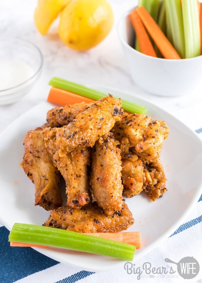 HOT AND HONEY AIR FRYER WINGS on white plate with carrots and celery (3)