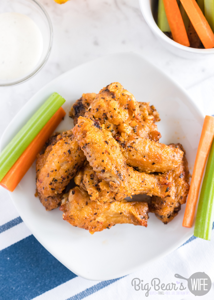 HOT AND HONEY AIR FRYER WINGS on white plate with carrots and celery (3)