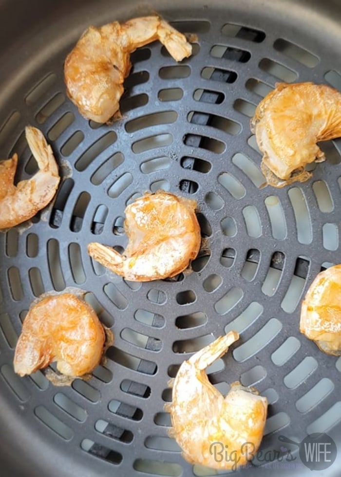 Single Layer of cooked Shrimp in air fryer basket