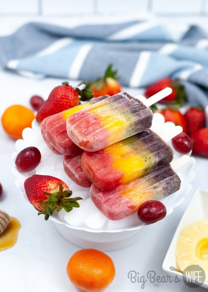 Perfect for summer and packed full of fruit, this Rainbow Popsicles Recipe makes the most beautiful popsicles that are all different colors!