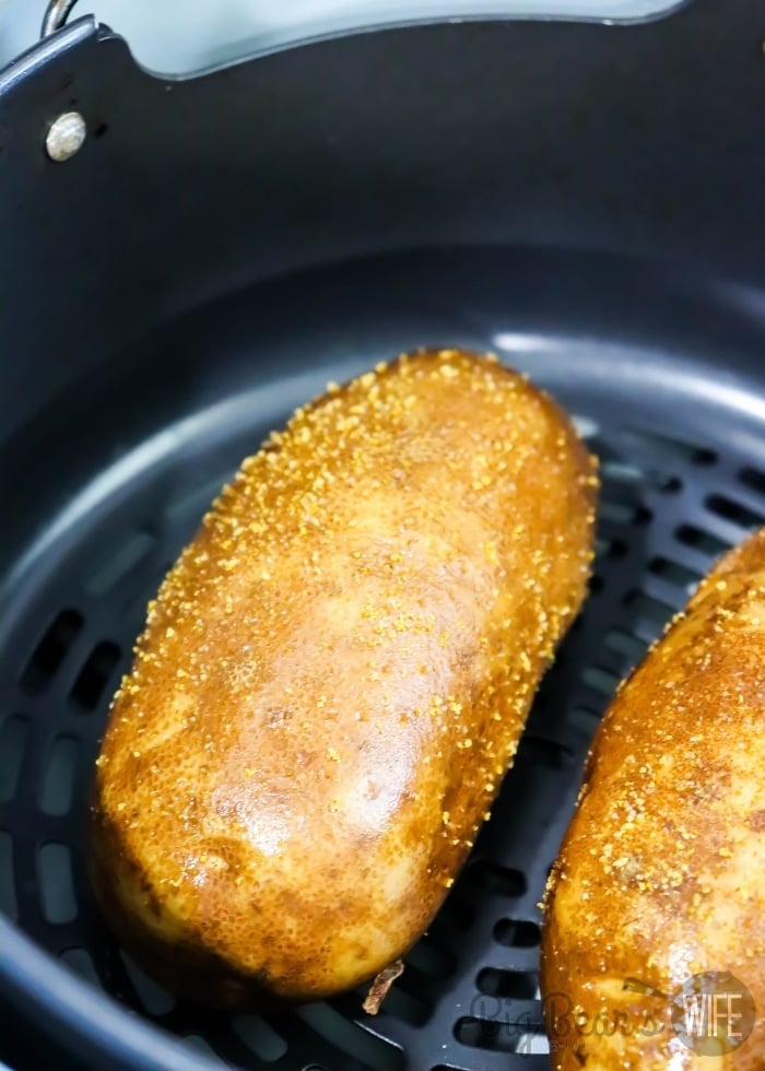 uncooked potato in the air fryer basket