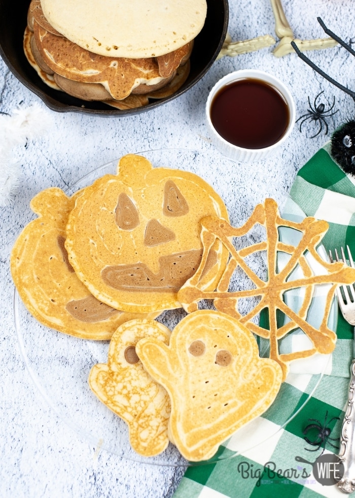 A Halloween breakfast that is perfect for any spooky Monster! These Halloween Pancakes are shaped like ghosts, pumpkins and spiderwebs!
