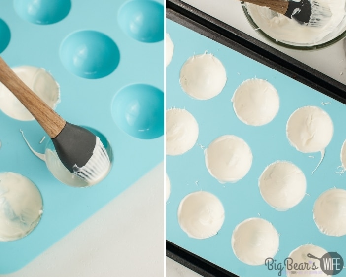 painting dome molds with melted white chocolate