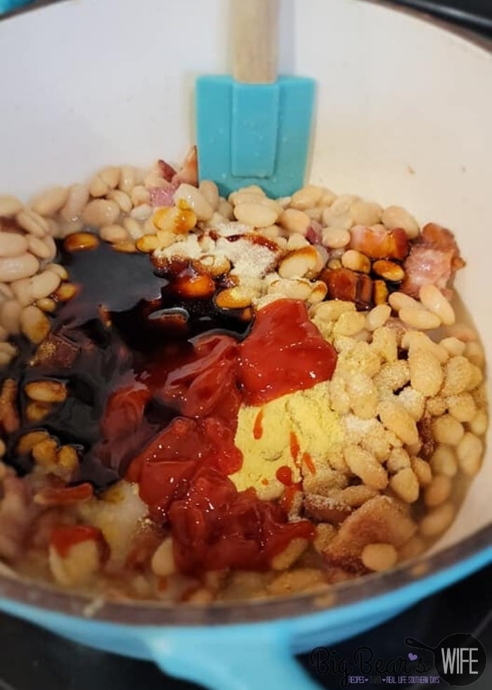 adding seasoning to beans