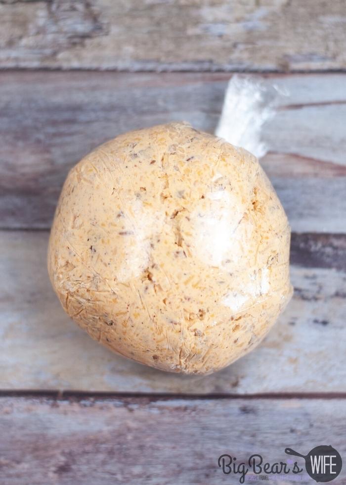plastic wrapped Pecan Crusted Cheese Ball