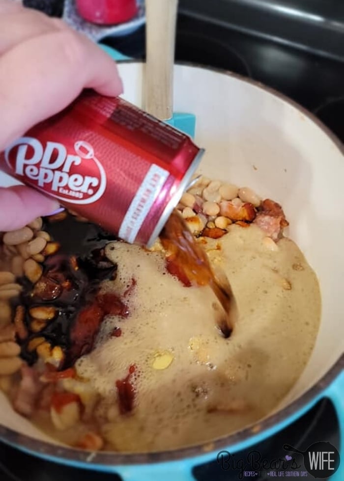 pouring dr pepper into beans