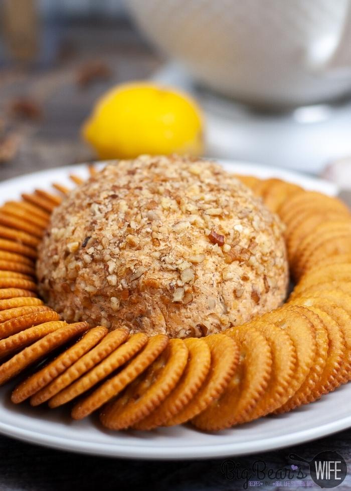 side shot of Pecan Crusted Cheese Ball with crackers