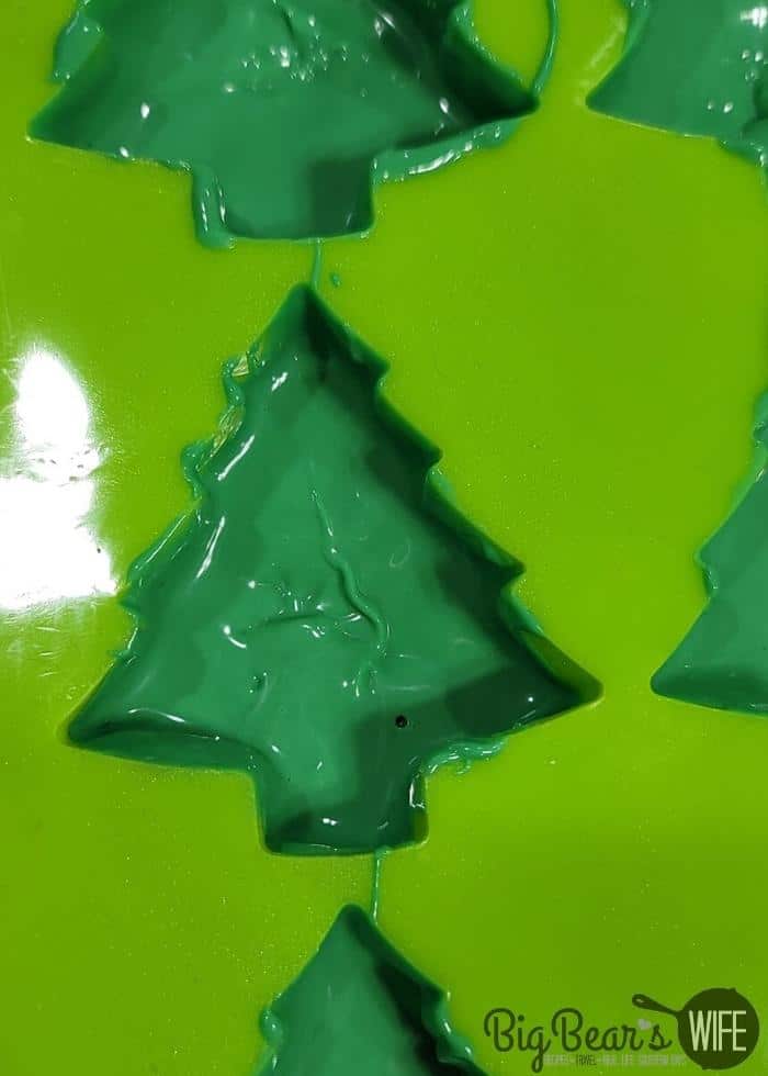 Filling Green Silicon Tree Mold with green melting chocolate to create shell
