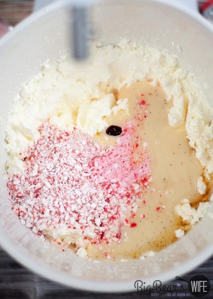 cream peppermint and red food coloring in a bowl for ice cream