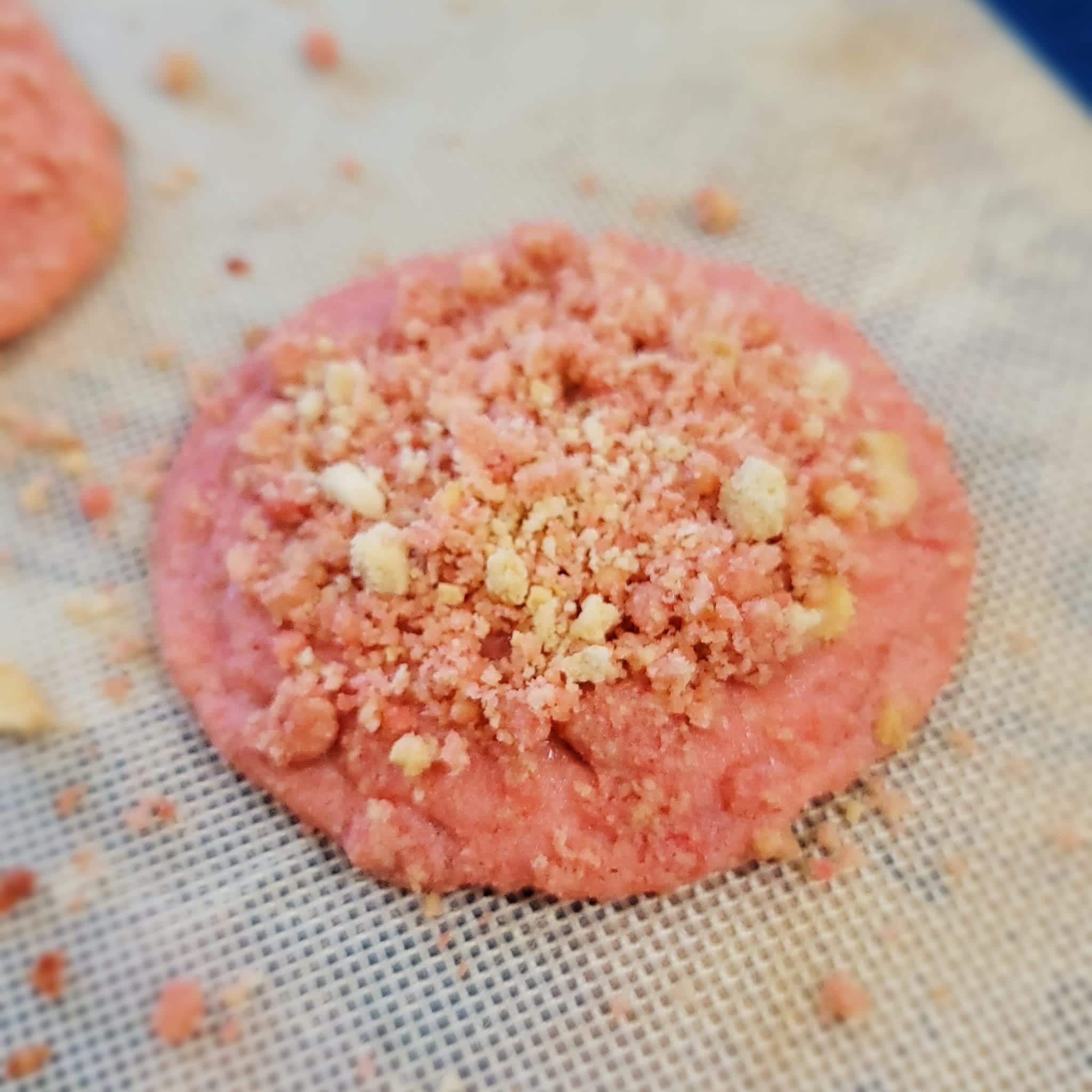 strawberry crunch topping on baked cookie before going back into oven