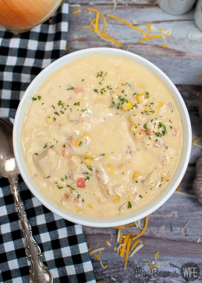 OVERHEAD VIEW CHICKEN CORN CHOWDER IN WHITE BOWL WITH INSTANT POT IN BACKGROUND