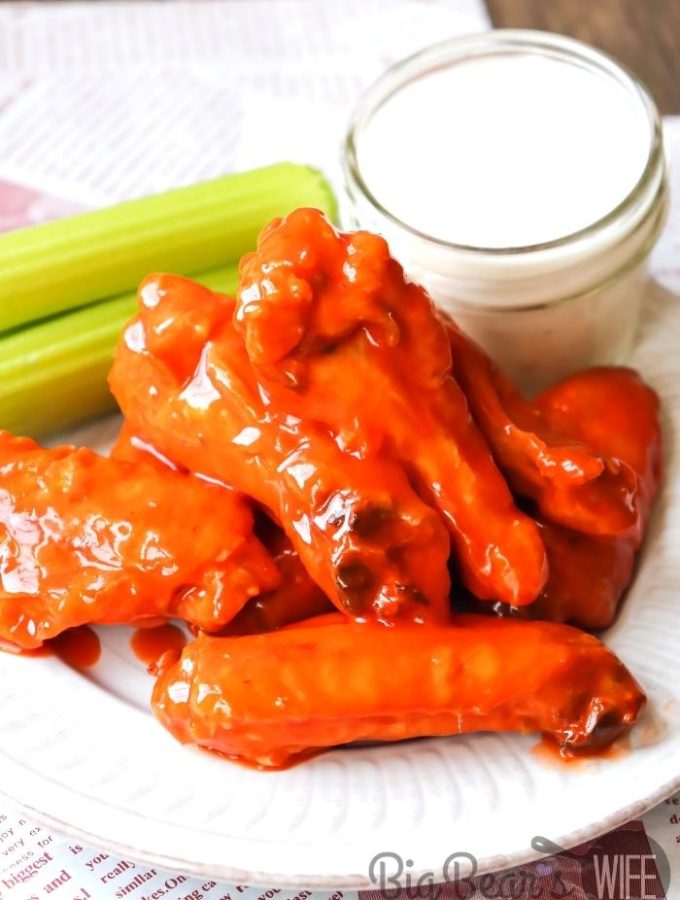 Air Fryer Buffalo Wings on white plate with ranch and celery (1)