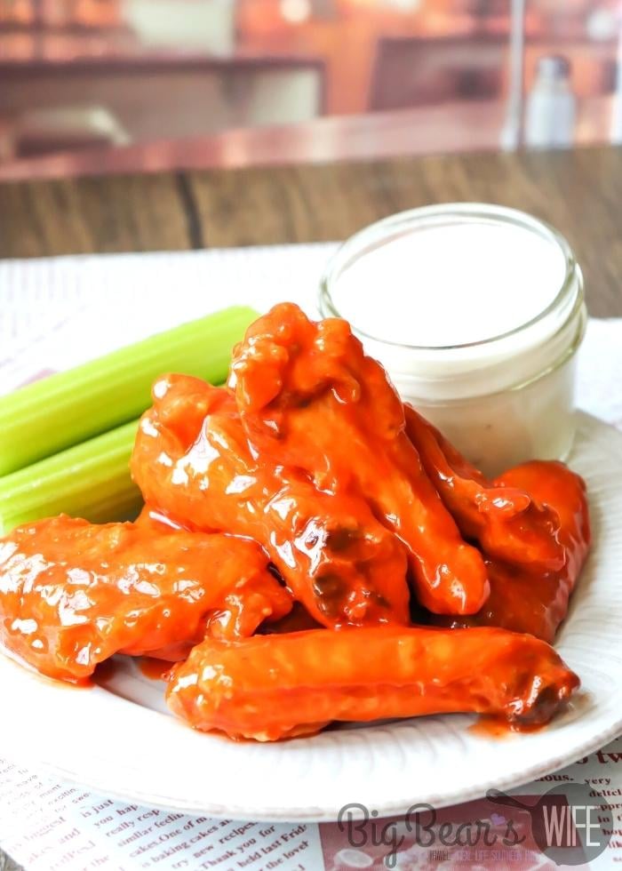 Air Fryer Buffalo Wings on white plate with ranch and celery