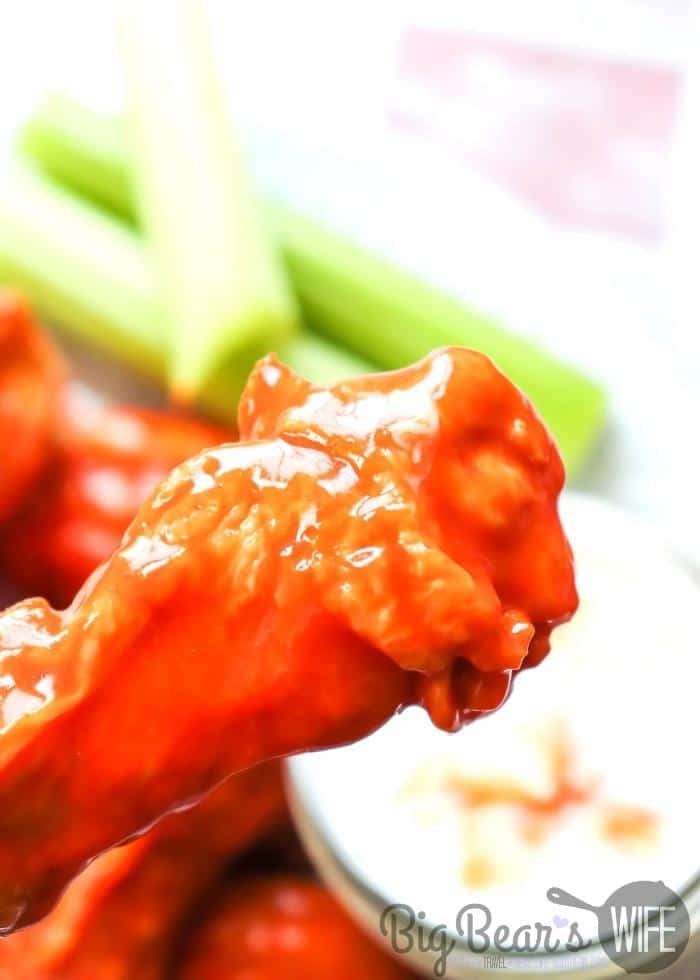 _buffalo wing infront of ranch and celery