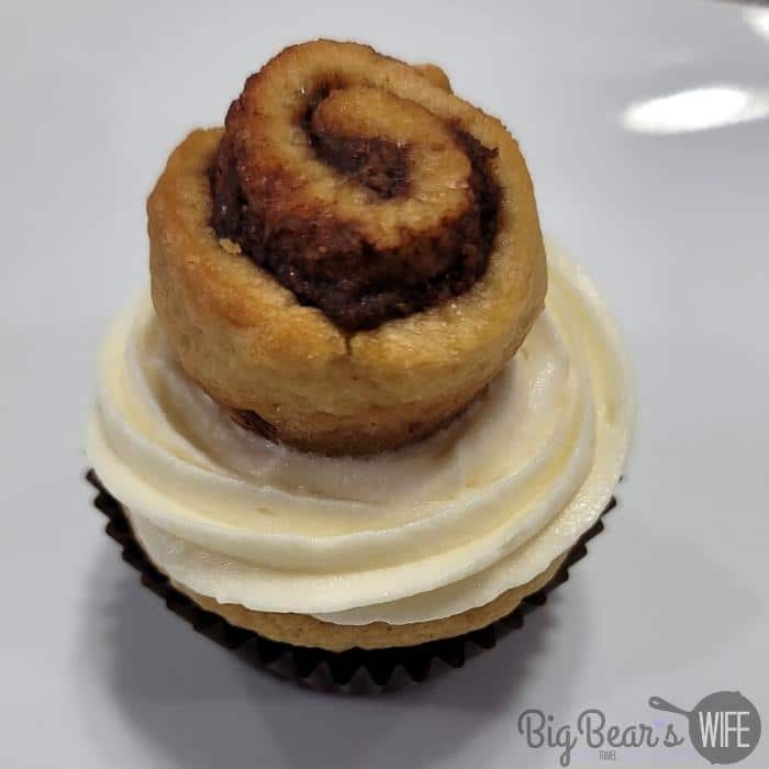 mini cinnamon roll on top of cupcake