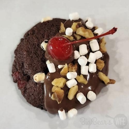Chocolate Sundae Cookie dipped in chocolate with walnuts and marshmallows topped with a cherry