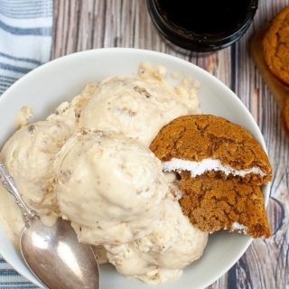 Oatmeal Cream Pie Ice Cream with broken oatmeal cookie snack cake and a blue and white cloth
