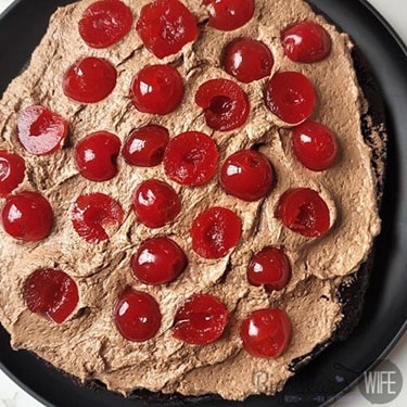 Top mousse with sliced maraschino cherries. 