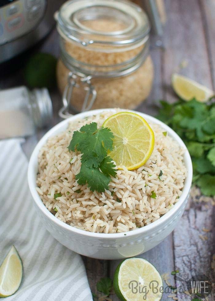 instant-Pot-Cilantro-Lime-Rice-in-white-bowl-with-jar-of-rice-behind-it