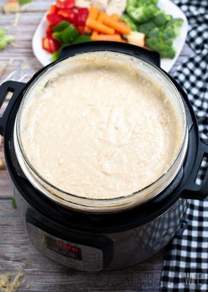 Instant Pot Copycat Melting Pot Cheese Fondue with veggies in th