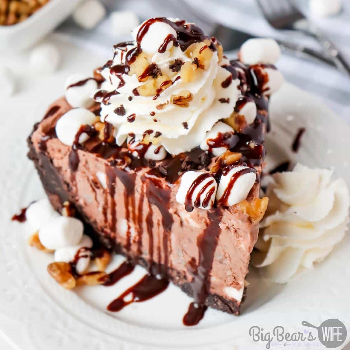 This frozen Rocky Road Pie is full of all of the classic rocky road flavors! With its frosty chocolate base, marshmallows and walnuts, this pie is just like rocky road ice cream in pie form!