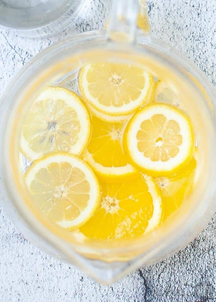 Lemons and orange slices in a pitcher