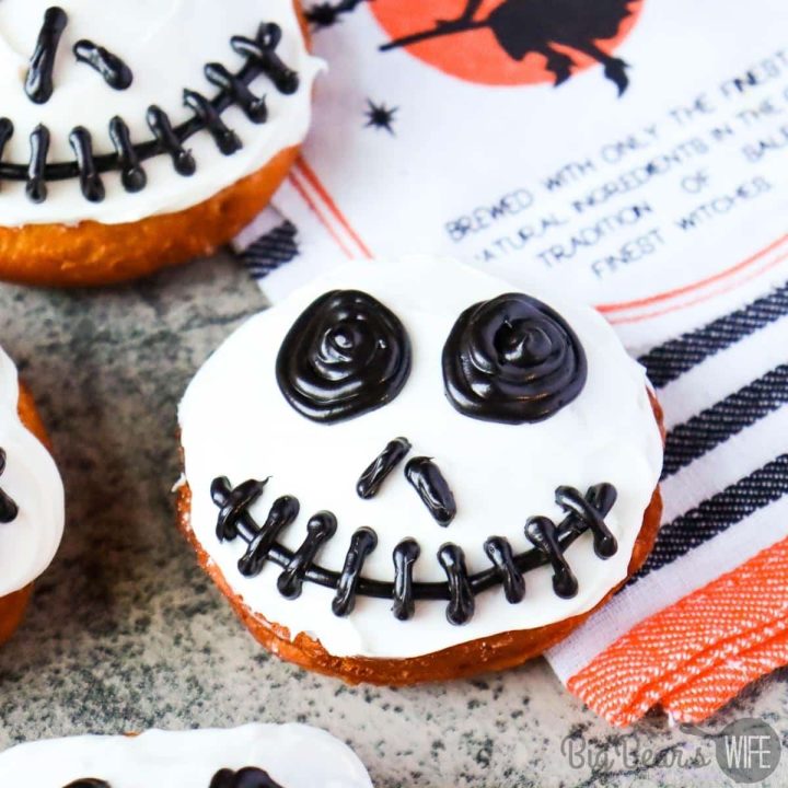 These Jack Skellington Biscuit Donuts are made with canned biscuits and fried until golden brown, before being decorated to look like Disney's Jack Skellington with frosting.