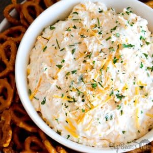 Ranch Beer Cheese Dip is a crazy easy dip recipe that'll be a hit at your next party, tailgate or game day get together! Cream cheese, ranch seasoning, cheese and beer! 4 ingredients and a bit of mixing is all you're going to need for this party dip!