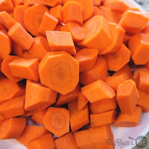 carrots coins on white plate