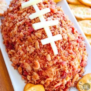 Make this Easy Football Cheeseball for the big game or any football party! You'll only need 5 ingredients and some plastic wrap to shape it! It'll be perfect for your game day spread!