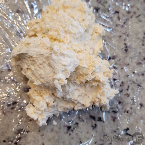 cheeseball mixture on top of plastic wrap