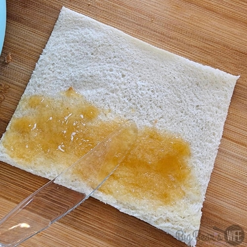 Smearing brown sugar butter on flat bread