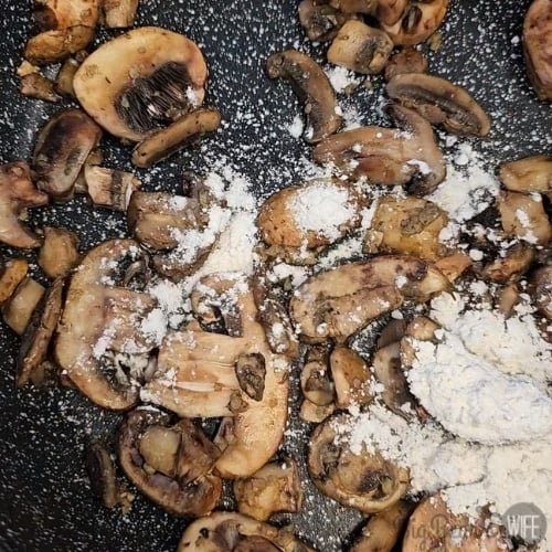 adding flour to mushrooms