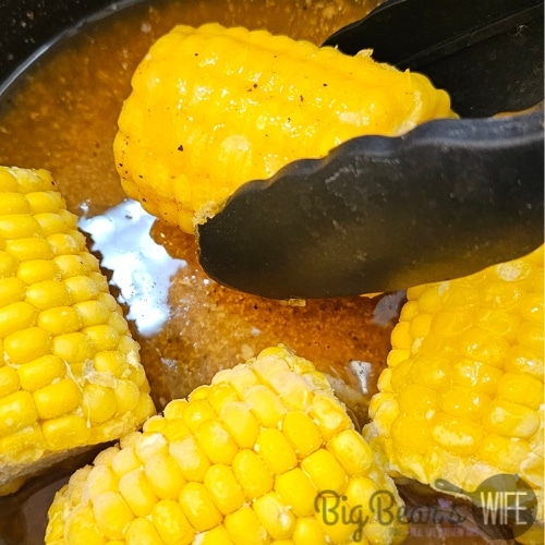 Rolling corn in butter