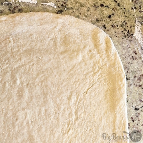 spread out cinnamon roll dough