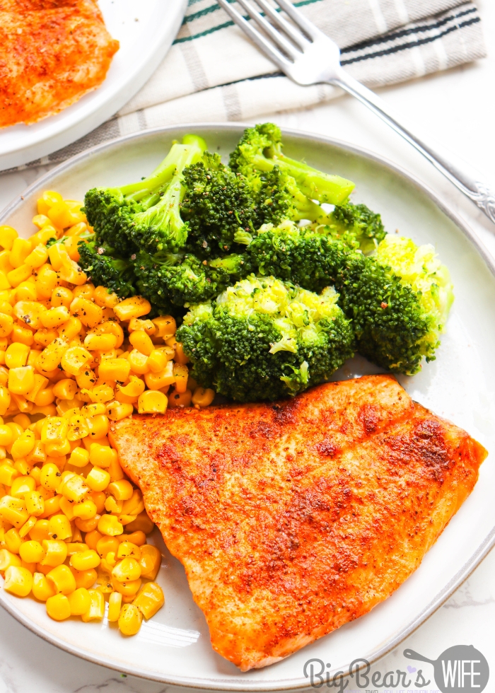 Air Fryer Old Bay Salmon Plated on a white plate with broccoli and corn