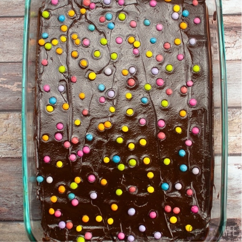 ganache on brownies with candy coated chocolates
